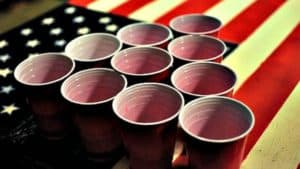 Solo cups on American flag signifying American Alcohol Addiction
