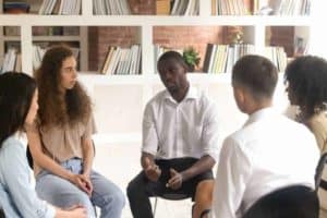 Millennials in group therapy for addiction treatment.